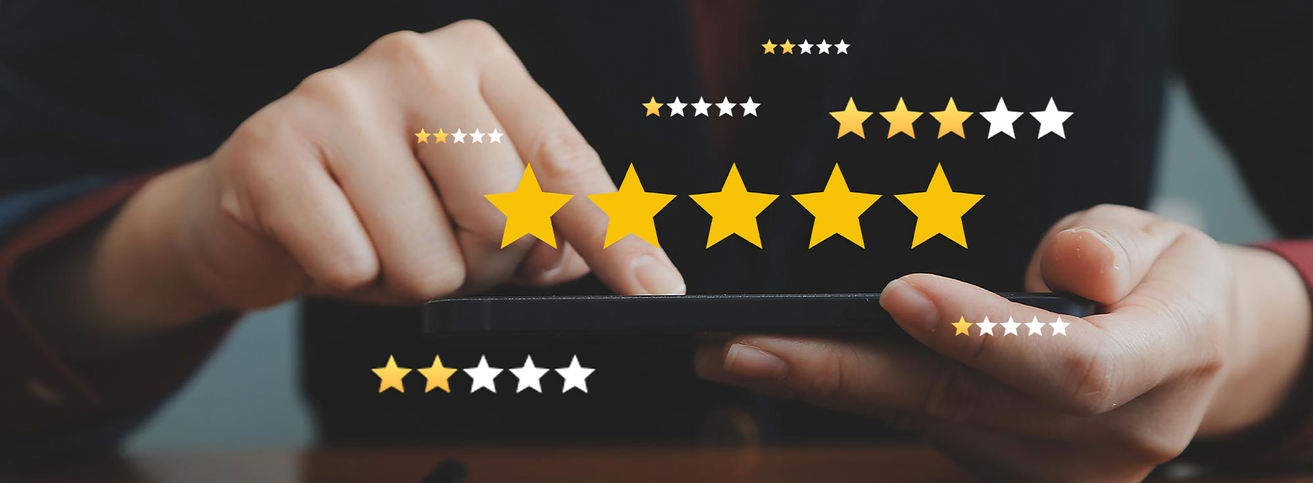The image shows a hand holding a tablet with a star rating graphic on the screen, indicating high customer satisfaction or approval.